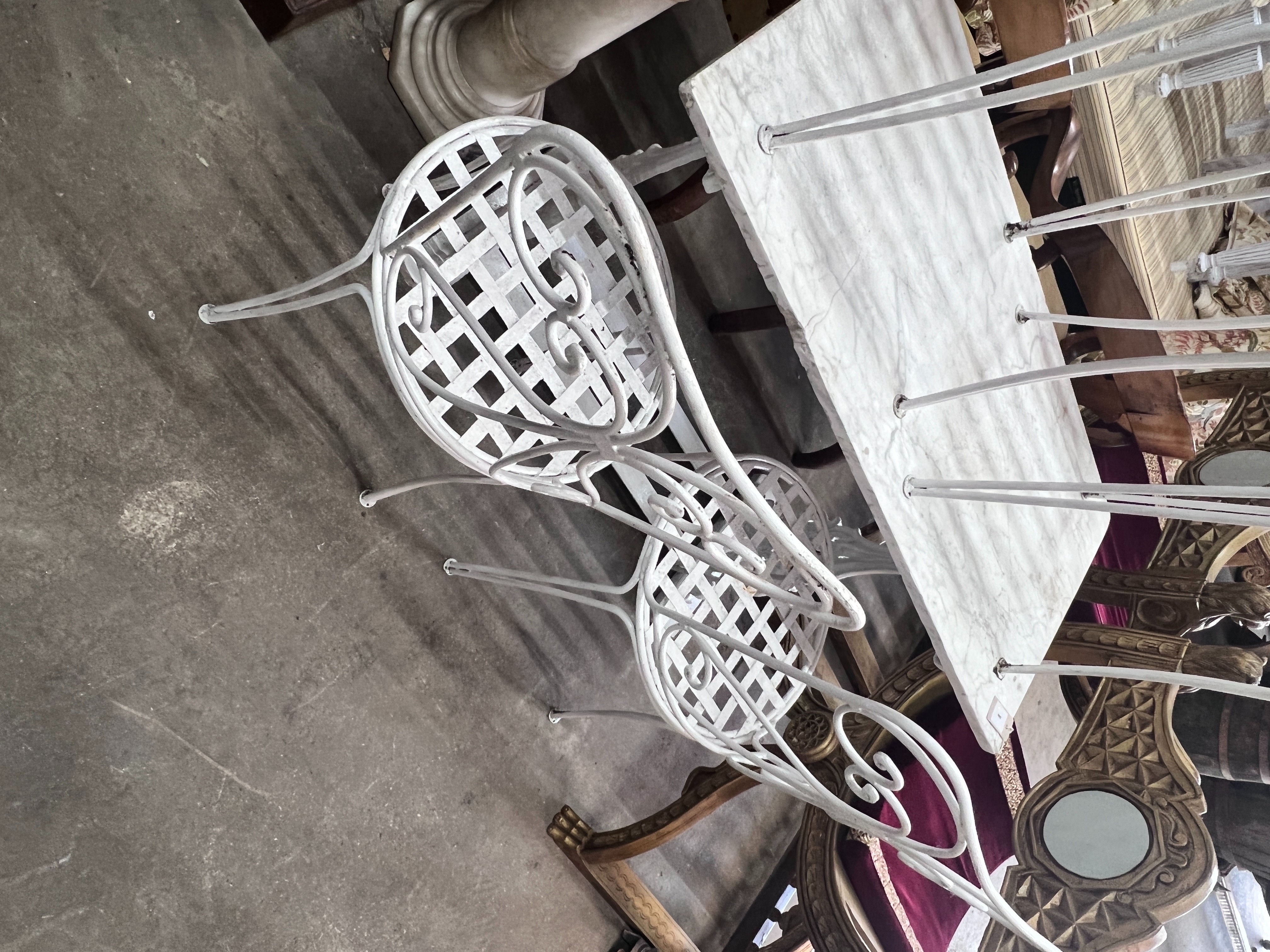 A set of four painted wrought iron garden chairs, height 96cm